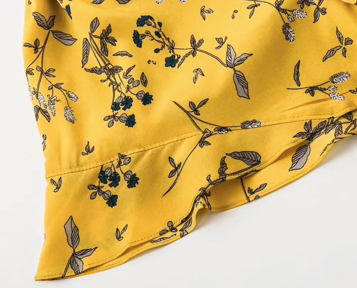 SUNNY SKIES FLORAL ROMPER